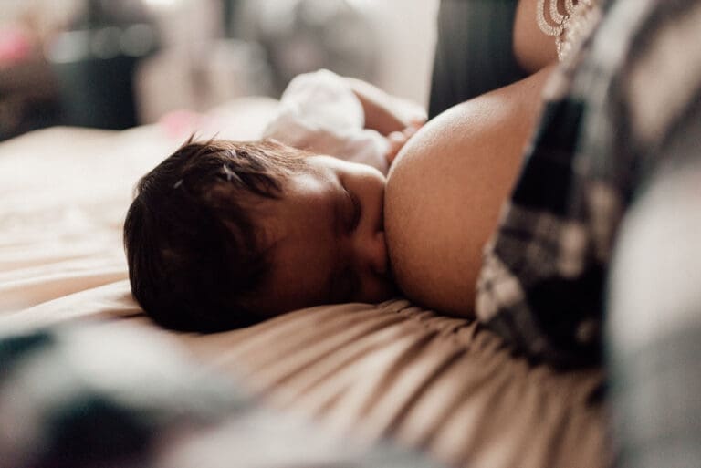 Mother breastfeeding baby